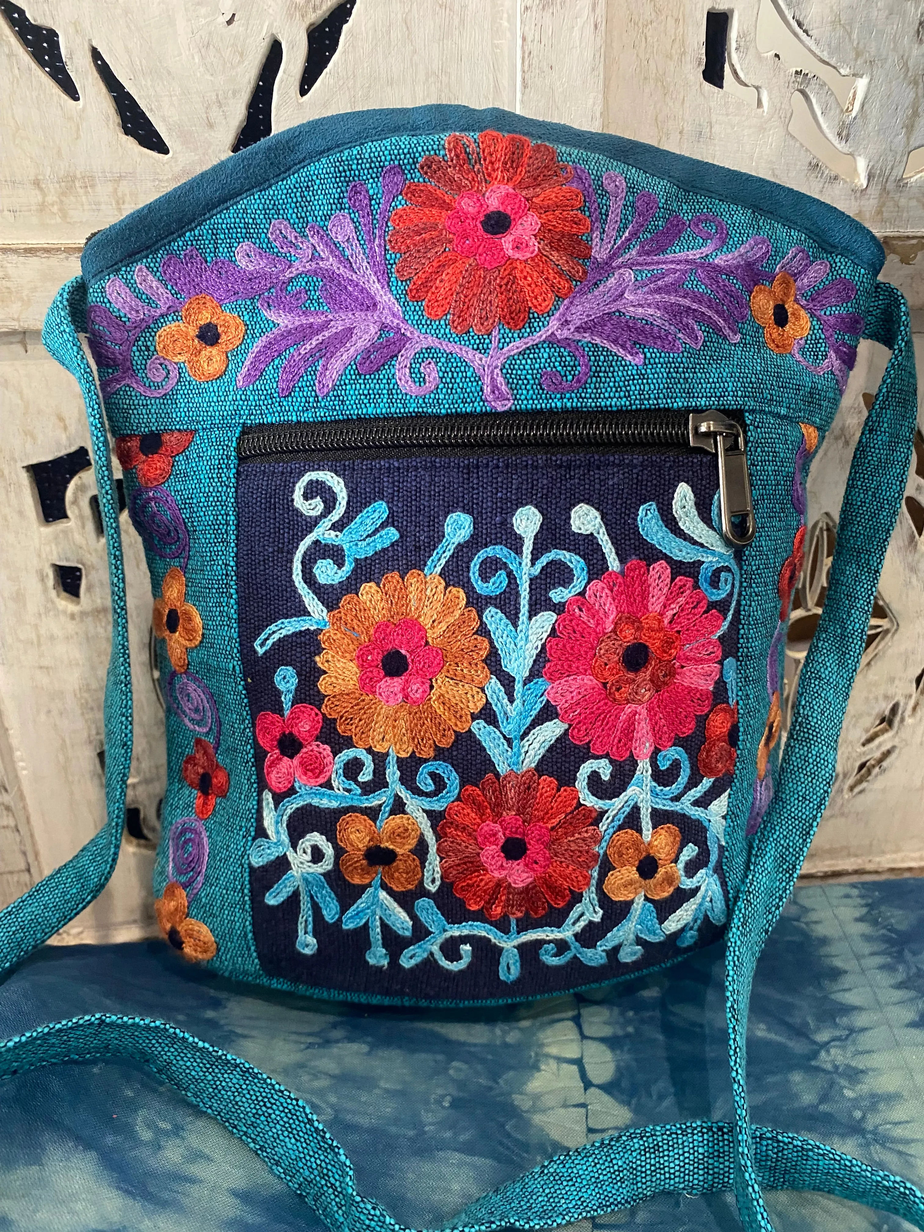 LWH Embroided Round Top Flower Handbag with shoulder strap.